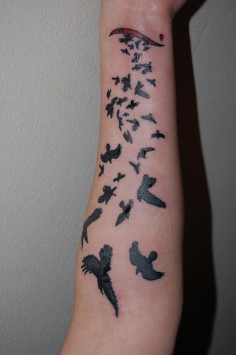 Black flying birds tattoo on hand - Tattooimages.biz